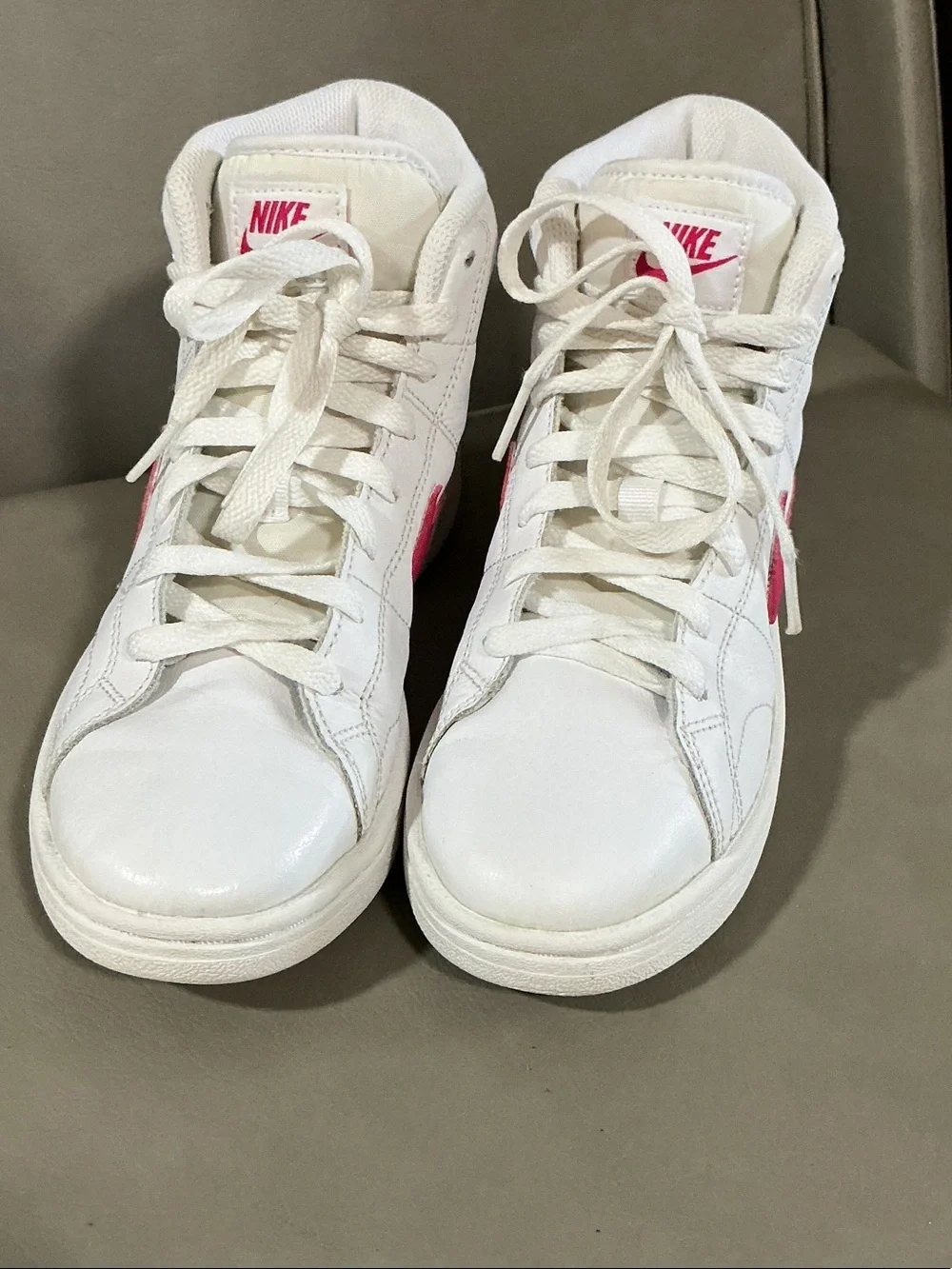 Nike Women's White Sneakers with Pink Swoosh High-Top